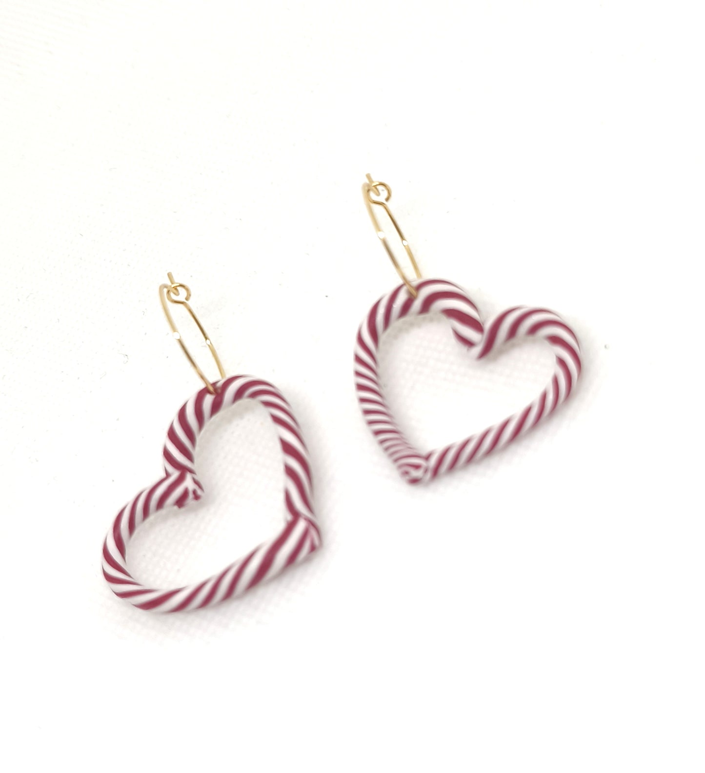 Red and white candy cane heart hoop earrings with 18k gold-plated hoops
