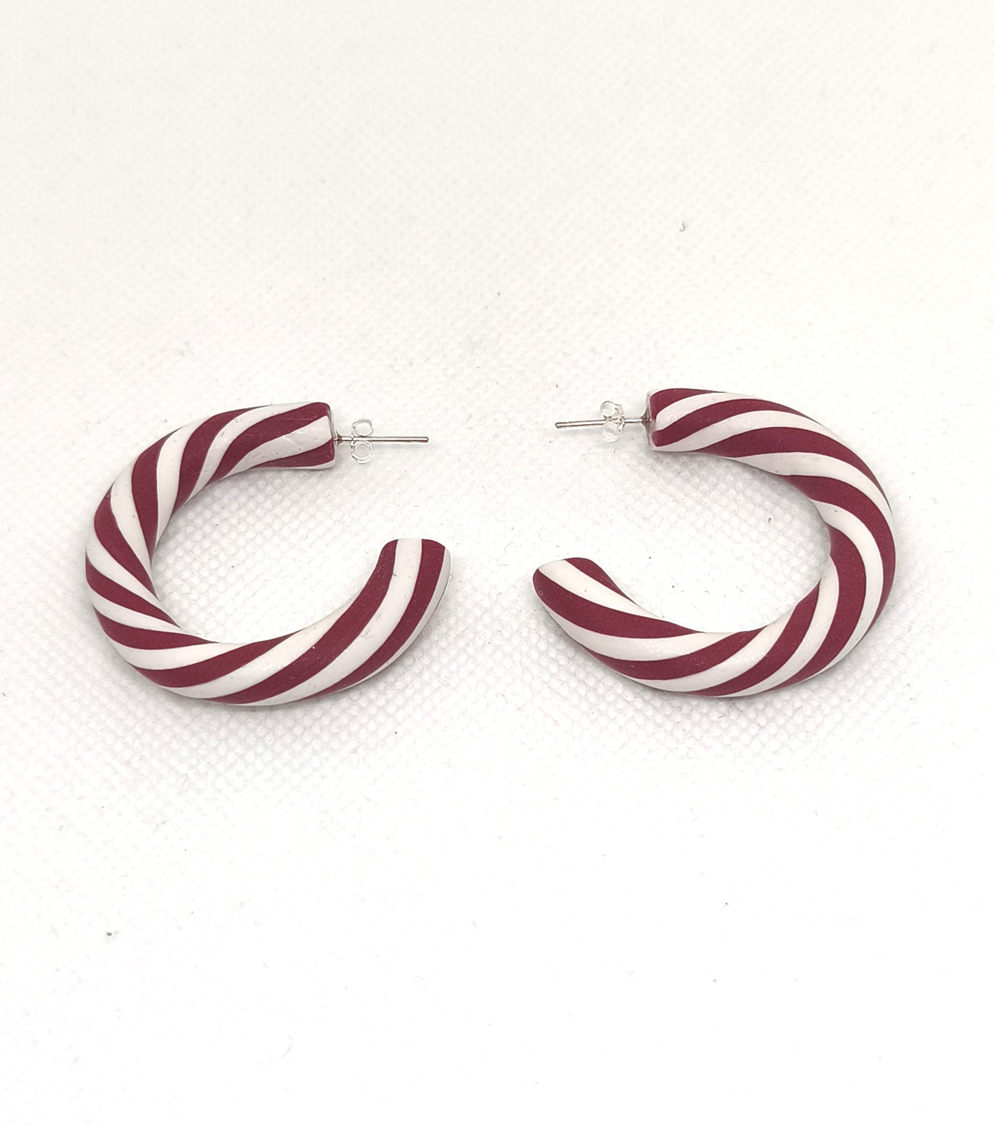 Red and white peppermint swirl hoop earrings with stainless steel studs